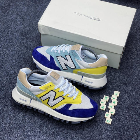 New Balance 574 Trainers In blue/yellow.